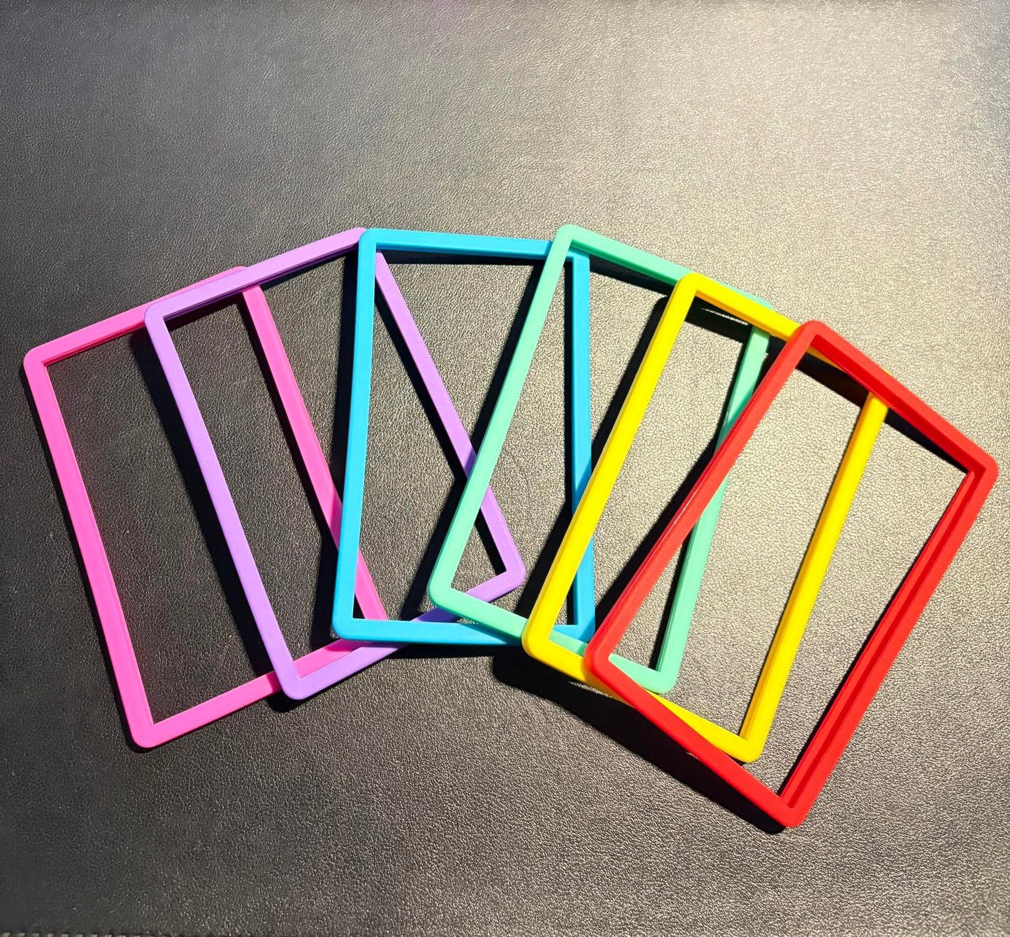 Slab Guard silicone bumpers for PSA slabs - six solid colors fanned out